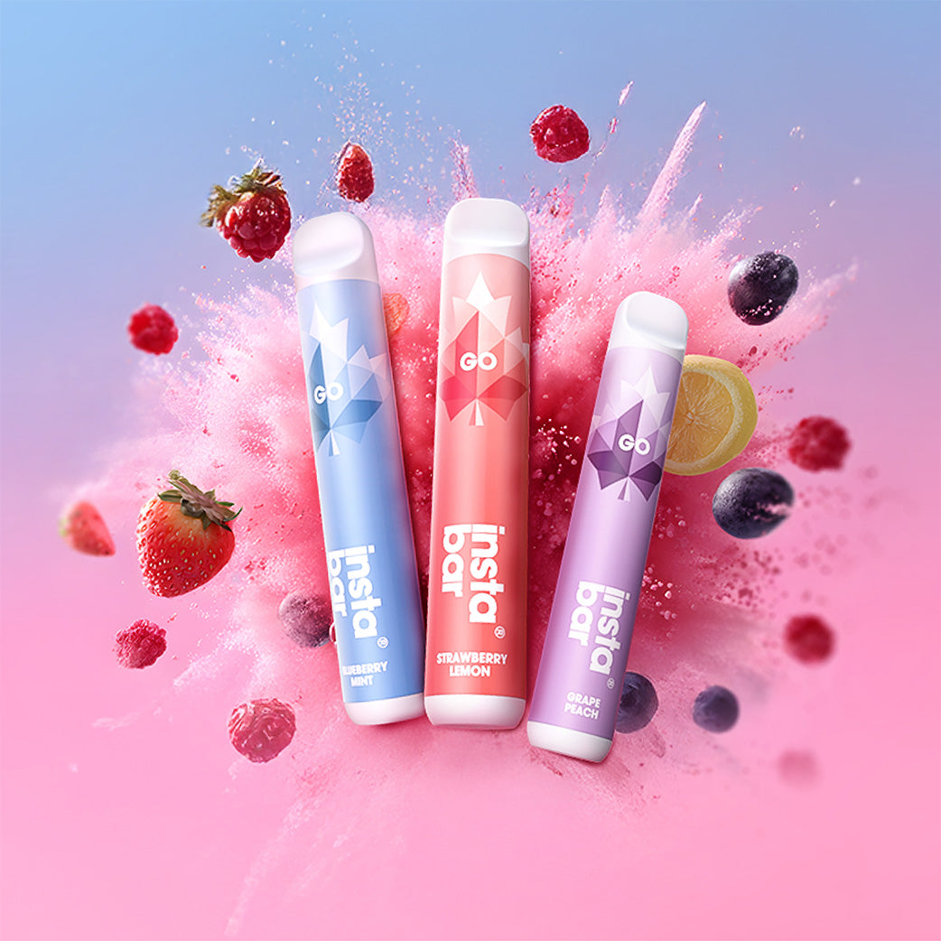 Three Insta Bar disposable vapes with colorful packaging on a pink and blue background with fruit.